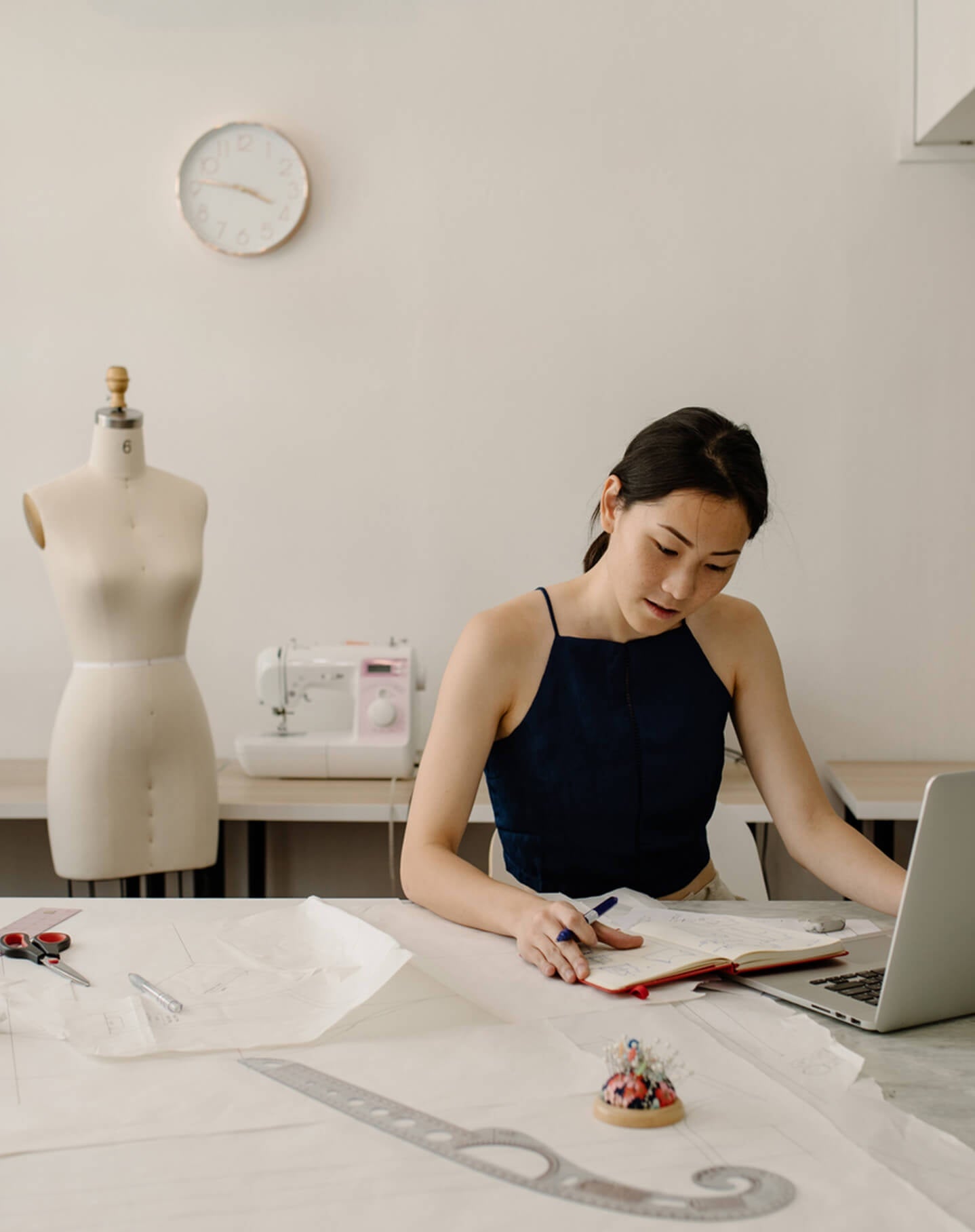 A fashion student works on her online portfolio